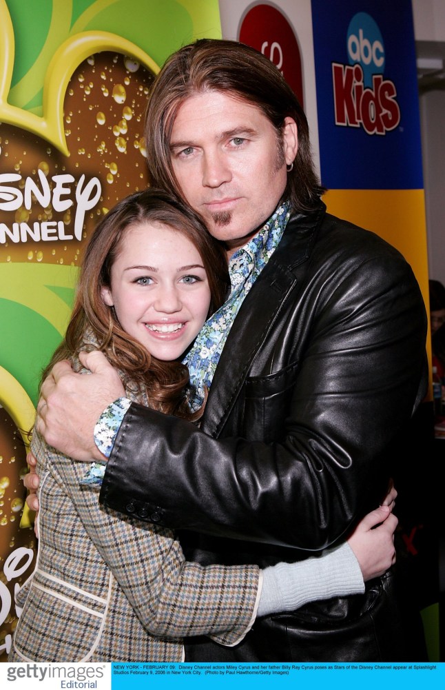 Disney Channel actors Miley Cyrus and her father Billy Ray Cyrus poses as Stars of the Disney Channel appear at Splashlight Studios February 9, 2006 in New York City. (Photo by Paul Hawthorne/Getty Images) *** Local Caption *** Miley Cyrus;Billy Ray Cyrus....* SPECIAL INSTRUCTIONS: * *OBJECT NAME: 56785266PH006_Disney_Channe*