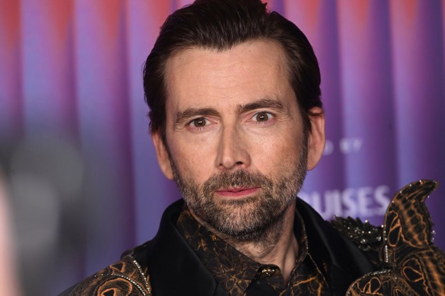David Tennant appearing stern at a red carpet event